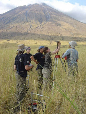 Setting up the GPS receiver during the gravity profile along the front of Ol Doinyo Lengai.